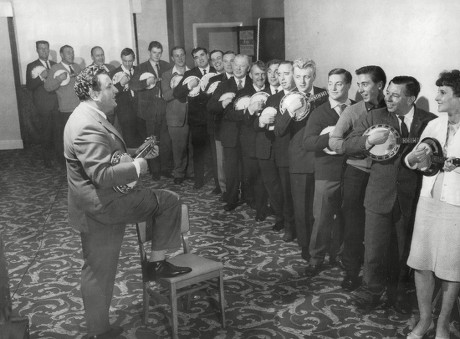Bill Logan Leads The Members Of The 'george Formby Society' In A Ukelele Sing Song. Logan A Carlisle Company Chairman Is The President Of The Society. Box 667 60902164 A.jpg.