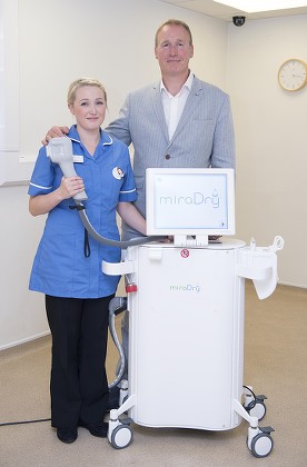 Ron Myers And Daughter Zoe Myers Photographed In Sutton Coldfield West Midlands. They Both Work At Medizen Which Treats People Who Suffer From Sweating. Ron Went To America And Found A Machine Called Miradry Which He Brought Back And Used Successfull