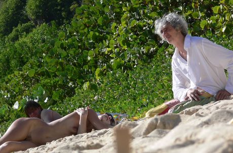 Louis Bertignac and girlfriend on a beach in the Caribbean - 17 Dec 2006