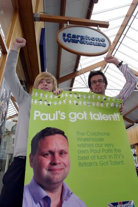 Staff from the Carphone Warehouse store in Macarthur Glen outlet centre, Bridgend, South Wales, celebrate Paul Potts' victory. Daniel Phillips (left) and Chris Norton (right) are both colleagues of Paul Potts