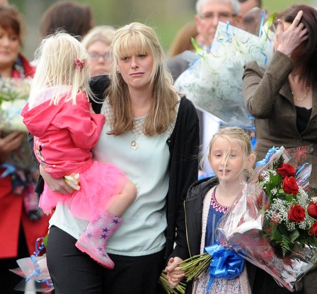 Jennifer Phillips Wife Of Pc David Phillips Who Was Run Down At Wallasey Docks Link Road North Wallasey Merseyside Lays Floral Tributes With Her Two Daughters Sophie 3 And Abigail 7.