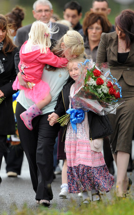 Jennifer Phillips Wife Of Pc David Phillips Who Was Run Down At Wallasey Docks Link Road North Wallasey Merseyside Lays Floral Tributes With Her Two Daughters Sophie 3 And Abigail 7.