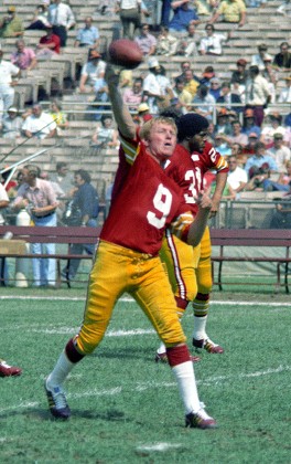 October 13, 1974 - Washington, District of Columbia, United States of  America - Washington Redskins quarterback Sonny Jurgensen (9) looks for a  receiver during the game against the Miami Dolphins at RFK