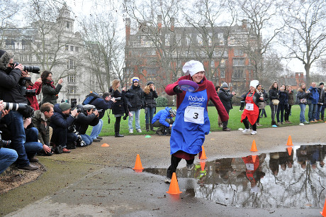 Shrove Tuesday Charity Pancake Race with Mps and Lords Joined by Media in A Race to the Finish. in Aid of Rehab