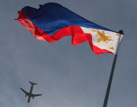 Airplane Flies By Philippine Flag Raised Editorial Stock Photo - Stock ...