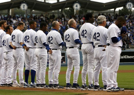 Los Angeles Dodgers wear uniform number 42 in honor of the 60th