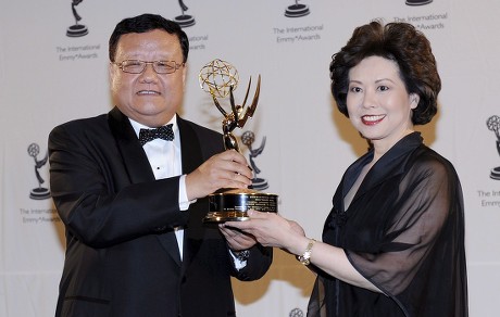 Chairman and Ceo of Phoenix Satellite Television Liu Changle (l) Wins the Directorate Award Presented by Us Labor Secretary Elaine Chao at the 36th Annual International Emmy Awards Gala in New York Usa 24 November 2008
