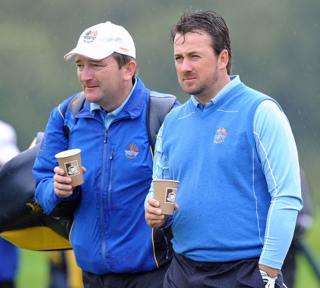 European Ryder Cup Player Graham Mcdowell (r) Enjoys a Cup of Coffee During the Second Days Official Practise with His Caddie on a Rain Soaked Celtic Manor Golf Course Newport Wales 29 September 2010 the Ryder Cup Starts on Friday 01 October 2010 and Finishes on Sunday 03 October 2010 United Kingdom Newport