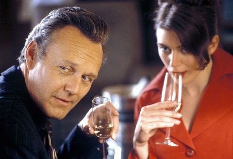 'Reversals'   TV 
Mr Andrew Barton (Anthony Head) Has a Drink with Judith Hobart (Claudia Harrison)