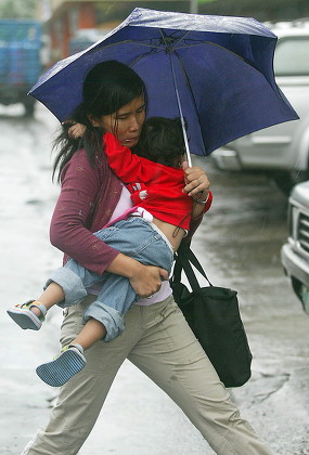 Filipino Woman Carries Her Child While Editorial Stock Photo - Stock ...