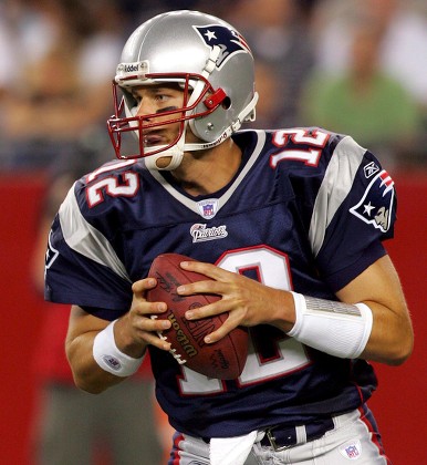 Tom Brady of the New England Patriots drops back to pass against