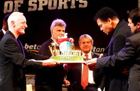 Boxing Legend Muhammad Ali (2nd R) Cuts a Birthday Cake Watched by Former Flying Pickets Singer Gary Howard (l) Long Jump Athlete Bob Beamon (hidden) Swimmer Mark Spitz Motorsport Icon Giacomo Agostini (3rd R) and Kulm World Cup Organizer Hubert Neuper (r) During the Gala 'Moments of Sports' Saturday 14 January 2006 in Bad Mitterndorf Austria Bad Mitterndorf