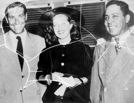 BETTE DAVIS AND GARY MERRILL WED IN MEXICO. BEEMING WITH SMILES POSE FOR PICTURES WITH JUDGE RAUL OROZOCCO, WHO PERFORMED THE 15 MINUTES CIVIL MARRIAGE CEREMONY.