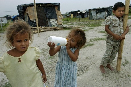 Four-year-old Iris Beltran (l) Her Three-year-old Sister Maria (c) and Six-year-old Brother Henry (r) Are Seen in Soyapango on the Outskirts of San Salvador El Salvador 19 May 2008 where Nearly 2 000 Salvadorians Have Their Homes the Land a Former Dump and the Precarious Conditions Are the Reflection of the Extreme Poverty and Lack of Housing in This Country El Salvador Soyapango