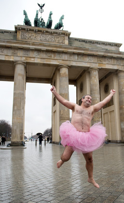 Bob Carey Dressed in a Pink Tutu Jumps in Front of the Brandenburg Gate in Berlin Germany 09 December 2013 the American Couple Bob and Linda Carey Founded the 'Tutu Project' by Taking Self Portraits in Pink Ballet Attire They Want to Raise Awareness For Breast Cancer the 'Carey Foundation' Helps Women That Suffer From Breast Cancer Germany Berlin