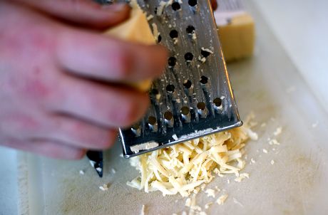 31 Grating cheese Stock Pictures, Editorial Images and Stock Photos