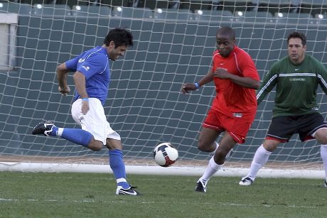 Mia Hamm and Nomar Garciaparra take part in a celebrity soccer