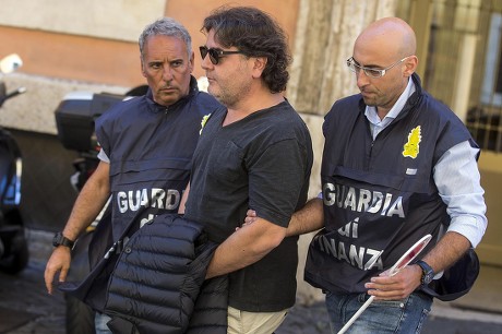 Stefano Ricucci (c) is Escorted by Tax Police out of 'Cadorna' Guardia Di Finanza Station After He Has Arrested in Rome Italy 20 July 2016 Tax Police in Rome on Wednesday Arrested Well Known Entrepreneurs Stefano Ricucci and Mirko Coppola For Allegedly Issuing and Using Invoices For Fake Operations the Fake Invoices Said to Be Worth About One Million Euros Were Allegedly Used by Ricucci to Obtain Liquidity Ricucci 54 a Roman Real Estate Entrepreneur was Arrested in 2006 on Stock Manipulation Charges in Connection with His Bid to Take Over Italian Publisher Rcs Coppola Managed a Number of Firms Owned by Ricucci Italy Rome
