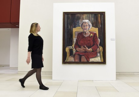 Victoria Parkinson Walks Next to a Painting of Britain's Elizabeth Ii by Welsh Artist Dan Llywelyn Hall at the Haymarket Virgin Money Lounge in London Britain 11 May 2016 the Exhibition Also Features Portraits of Amy Winehouse and David Bowie Michael Palin Sir Michael Caine Among Others to Commemorate the Anniversary of the End of the First World War with the War Memorials Trust and the Victoria Cross Trust Will Be the Charitable Beneficiaries of the Exhibition the Exhibition Runs From 09 May to 04 May United Kingdom London