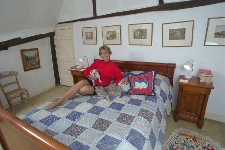 Actress Alexandra Bastedo On Her Bed At Her Country Home Near Chichester. 