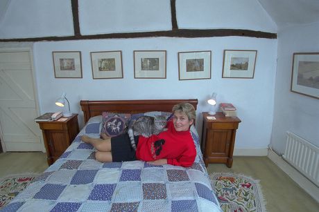 Actress Alexandra Bastedo On Her Bed At Her Country Home Near Chichester. 
