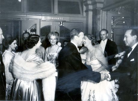 King George Vi (died 6/2/52) 13 November 1950. King And Queen At The Royal Command Variety Performance At London Palladium. King Shakes Hands With Jack Benny And Princess Elizabeth (queen Elizabeth Ii)leans Foreward To Shake The Hand Of Dinah Shore P