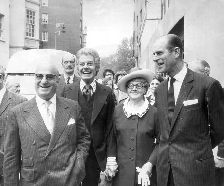 Prince Philip The Duke Of Edinburgh Looking At One Of The Two ''sunshine '' Coaches Presented By Danny La Rue At The Variety Club Luncheon At Dorchester In The Picture Is Danny''s Mother And The Chief Barker Ben Rosenfield.