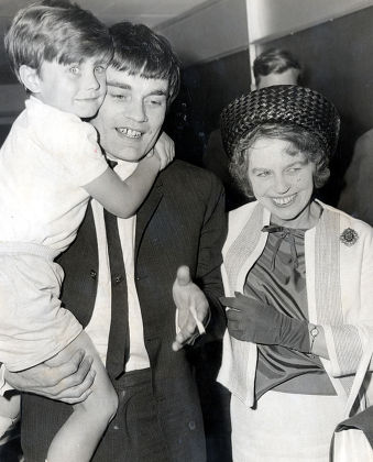 Jimmy Nicol Former Drummer Who Is Known As The Fifth Beatle After He Replaced A Tonsillitis Stricken Ringo Starr On The Beatles 1964 World Tour Is Pictured With His Son Howard And His Mother On His Return To Heathrow From Australia.