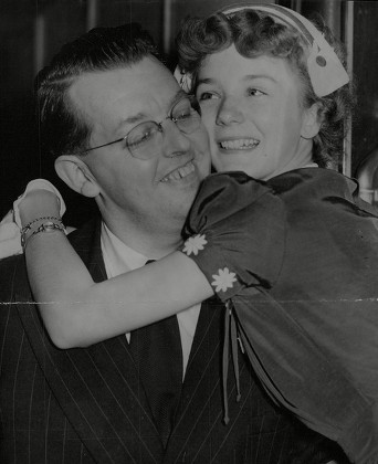 Actress Kathryn Beaumont Is Greeted By Her Father Ken Beaumont At Waterloo Station. Box 711 825101632 A.jpg.