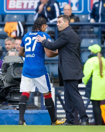 Carlos Pena of Rangers gets a pat from Rangers Manager Pedro Caixinha as he is substituted during the Betfred Cup Semi-Final between Rangers & Motherwell at Hampden Park, Glasgow on 22nd October 2017