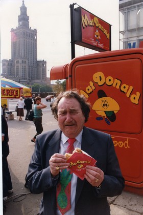 Sir John Harvey-jones Eating A Mat Donald Burger In Warsaw Poland.