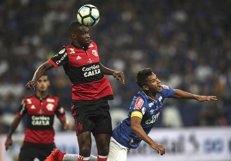 Gustavo Henrique of Brazil's Flamengo, top, heads the ball as