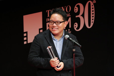 Director Edmund Yeo speaks after winning "Award for Best Director " for the film "AQERAT (We the Dead)"