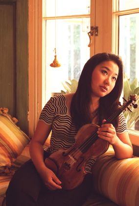 Violinist Sarah Chang Violinist Sarah Chang 20. She Is Currently In London To Play The Dvorak Violin Concerto With The London Philharmonic. She Took Her First Lesson At Four Years Old And Was Performing In Public At Eight And Has Been Described By Ye