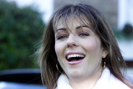 British Actress Liz Hurley Leaves Her Home In London...british Actress Liz Hurley Smiles At Photographers As She Leaves Her Home In West London November 9 2001. Hurley Announced Yesterday That She Is Expecting Her First Baby In April Next Year With H