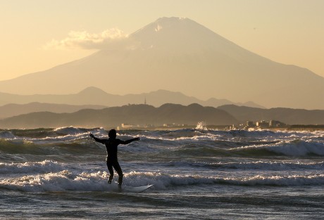 BEGINNER SURFER TRIES RIDE ON WAVE Editorial Stock Photo pic