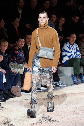 A model wears a creation by Kim Jones for Louis Vuitton men's Fall