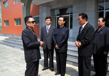 KIM JONG IL IN FOREGROUND SUNGLASSES Editorial Stock Photo - Stock 