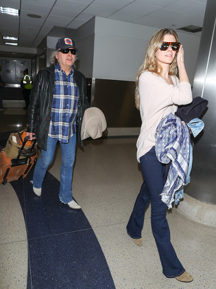 Dwight Yoakam and Emily Joyce at LAX International Airport, Los Angeles, USA - 26 Feb 2018