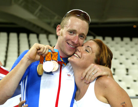Olympic Games 2004. Great Britain Triple Cycling Medallist Bradley Wiggins With Gold Silver & Bronze Medals He Has Won With Fiancee Cath Cockran.