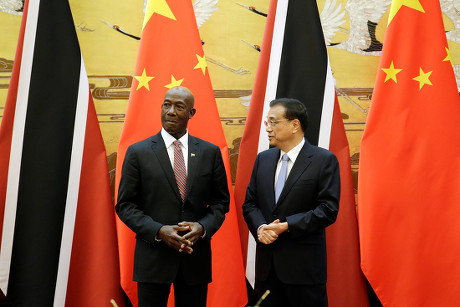 China's Premier Li Keqiang speaks to Trinidad and Tobago Prime Minister Keith Rowley during a signing ceremony in Beijing - 14 May 2018