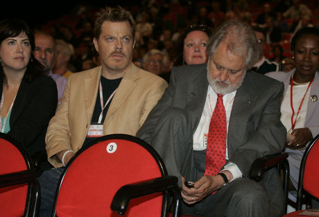 Comedian Eddie Izzard Listens To David Blunkett Speaking To The Labour Party Conference As Film Producer Lord (david ) Putnam Conducts A Text Message Conversation.