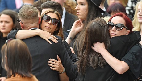Anthony Cotton. (l To R) Coronation St. Actresses Anthony Cotton With Kym Marsh And Kate Oates Hugs Faye Brooks At The Funeral Of Manchester Arena Bomb Blast Victim Martyn Hett 29 At Stockport Town Hall Stockport Cheshire.
