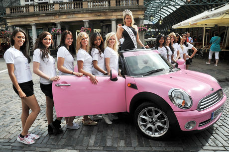 Miss England finalists attempt to drag a pink convertible Mini car, London, Britain - 14 Jul 2009