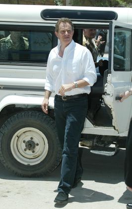Action Man Prime Minister Tony Blair Alights A Landrover As He Arrives At The Khadija Alkobra Girls School In The Southern Iraq Town Of Basra. See Ross Benson Story.