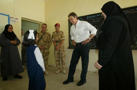 Prime Minister Tony Blair Has Twinkle Twinkle Little Star Sung To Him At The Khadija Alkobra Girls School In The Southern Iraq Town Of Basra During His Visit. See Ross Benson Story.