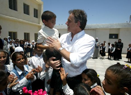 Prime Minister Tony Blair Receives A Peck On The Cheek From 6 Year Old Abbas Adnan At Khadija Alkobra Girls School In The Southern Iraq Town Of Basra During His Visit. See Ross Benson Story.