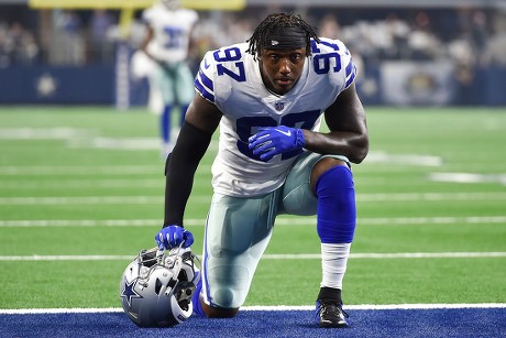 Dallas Cowboys defensive end Taco Charlton (97) walks off the