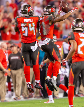 The Tampa Bay Buccaneers defense celebrates an interception during