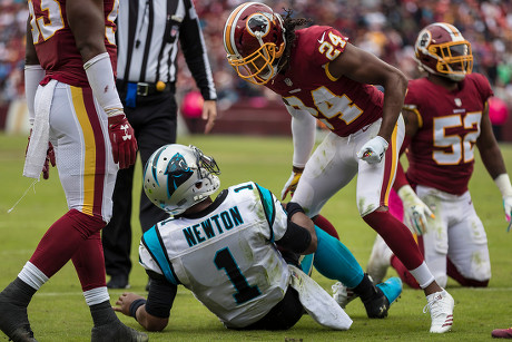 Landover, Maryland, USA. 14th Oct, 2018. Washington Redskins cornerback  Josh Norman (24) has words with Carolina Panthers quarterback Cam Newton  (1) during the NFL game between the Carolina Panthers and the Washington